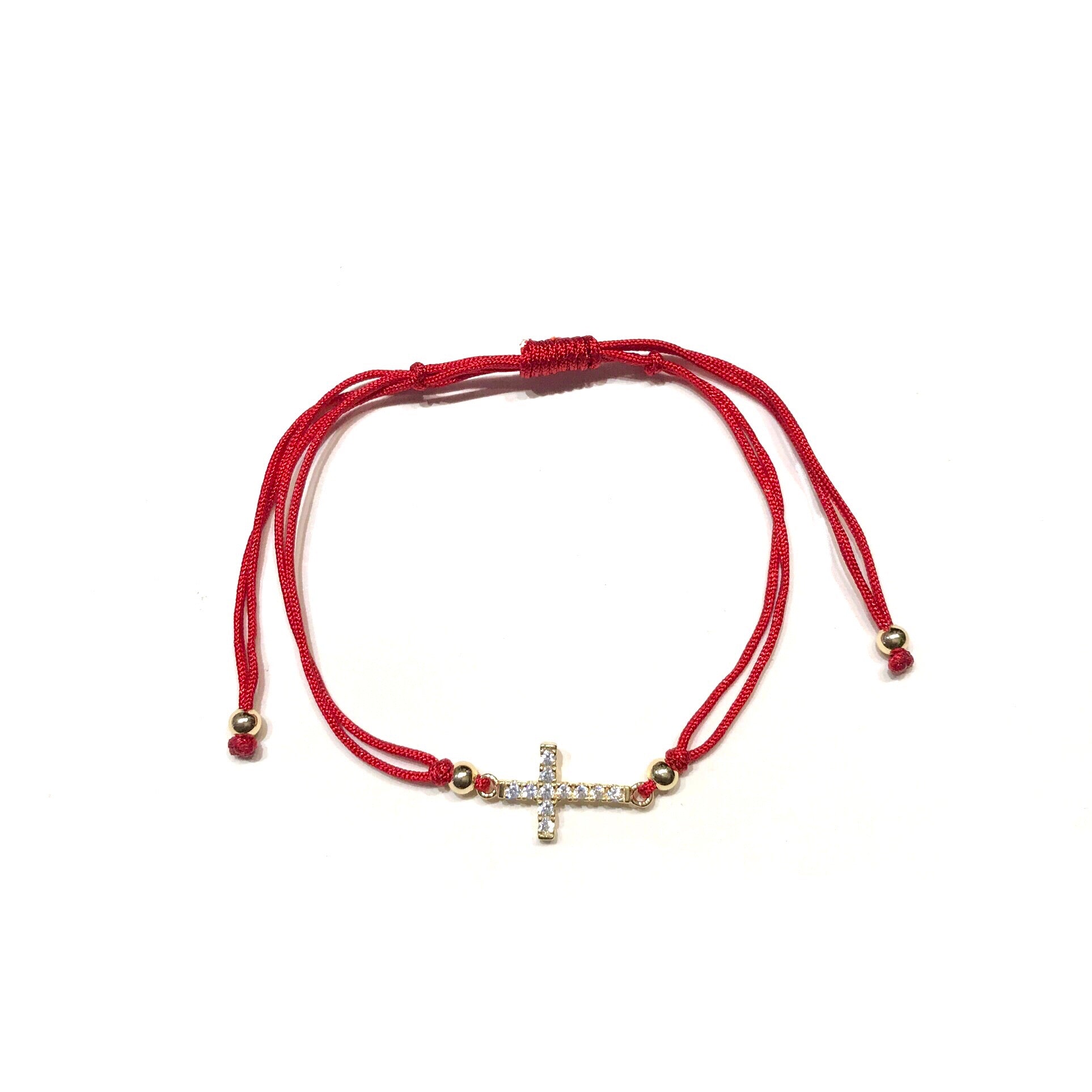 Red string bracelet deals with cross